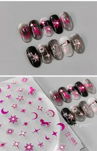 Detail showing 5D embossed Christmas nail stickers with moon, stars, and rose red laser patterns