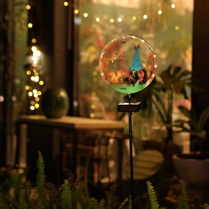 Solar powered garden silhouette light with metal squirrel and elf design for outdoor decor