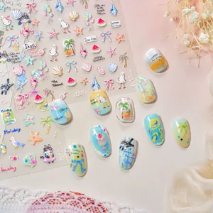 Detail of 3D embossed nail stickers featuring summer beach motifs and cute cat designs