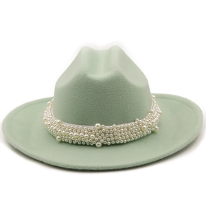 Detail of mint green wool fedora with elegant multi-layered white pearl decorative band