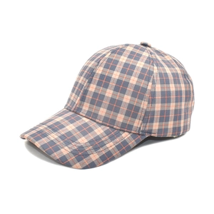Detail view of colorful plaid baseball cap with grey, blue and orange checkered fabric