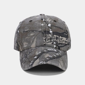Close-up of classic forest camouflage baseball cap with six-panel structure and curved brim