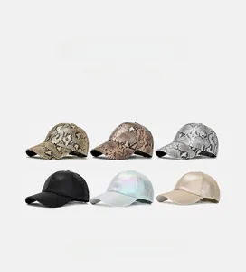 Detail view of baseball caps in various snakeskin patterns and solid metallic colors