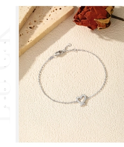 Detail of S925 sterling silver heart bracelet with sparkling VVS1 moissanite accents