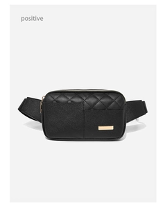 Detail of black quilted faux leather waist bag featuring golden metal hardware accents