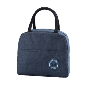 Dark blue insulated lunch bag with black handles and panda logo on white background