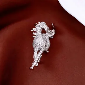 Exquisite 14K gold plated pegasus horse brooch with sparkling zircons on red silk