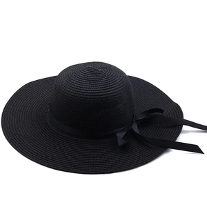 Elegant wide brim black straw hat for women with ribbon bow for summer beach vacation