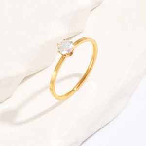 Minimalist 1mm gold titanium ring with a round shimmering white opal in a six-prong setting