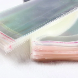 Clear self-sealing plastic OPP packaging bags with red adhesive strips for socks