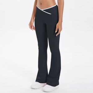 Detail of cross V-waist yoga pants with white contrast piping and slim flared leg fit