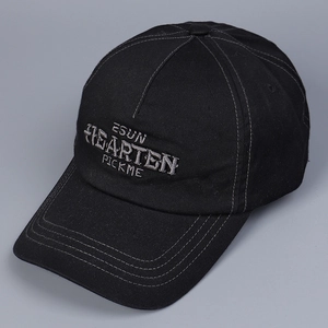 Close-up of grey letter embroidery on black cotton twill baseball cap with reinforced stitching