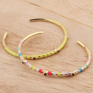 Fashionable enamel striped open bracelets in gold finish with colorful diamond accents