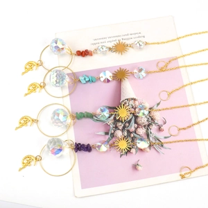 Golden moon sun catcher pendants with healing crystal stones and sparkling prism balls