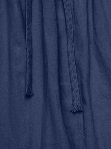 Detailed close-up of dark blue linen texture and woven drawstring on men's trousers