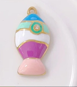 Detailed close-up of fish-shaped enamel pendants with gold plating and rhinestones
