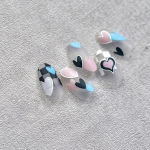 Japanese style nail art stickers with colorful heart patterns and checkerboard designs