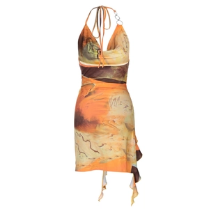 Detail of summer halter dress with orange abstract print and metal ring connector