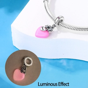 Luminous pink heart charm in 925 silver finish showing glow-in-the-dark effect