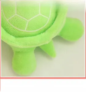 Detail of plush turtle toy showing soft short-pile fabric and white shell pattern texture