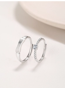 Macro detail of S925 silver couple rings featuring matte texture and pave cubic zirconia