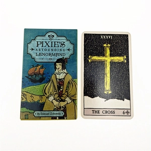 Close-up of Pixie's Astounding Lenormand blue oracle box and the gold Cross card
