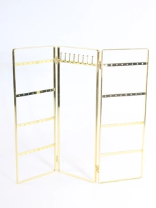 Three-panel gold metal jewelry display stand with hooks and perforated earring bars