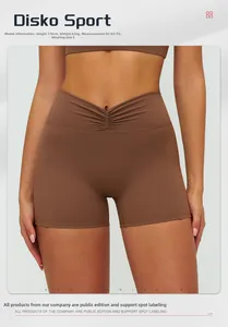 Detail of high waist yoga shorts with V-shaped ruching and brown breathable fabric