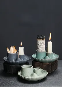 Macro shot of ceramic sage and palo santo holder with lotus edge in deep gray finish