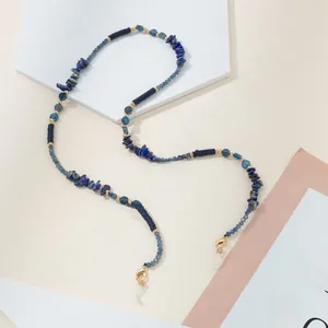 Detail of beaded eyewear chain with blue natural stones, gold lobster claws and silicone loops