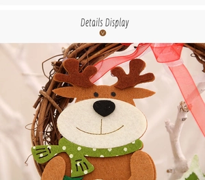 Close-up of felt reindeer decoration with polka dot scarf on natural rattan wreath