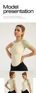 Close-up of contrast color yoga shirt with side ruching and curved hem for slim fit