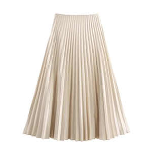 Detail of elegant champagne pleated midi skirt showing silky satin fabric and fine pleats
