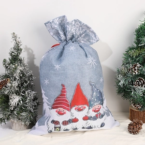 Christmas burlap drawstring gift bag with festive gnome print and white snowflake patterns