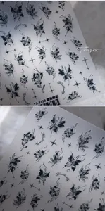 Macro detail of 5D ink butterfly nail art stickers with delicate matte star patterns