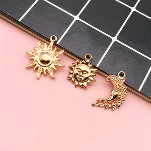 Golden sun and moon alloy charms for DIY jewelry making including face pendants