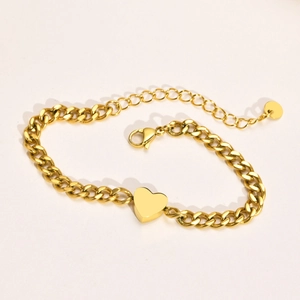 Elegant gold heart pendant bracelet with a minimalist Cuban chain and secure lobster clasp