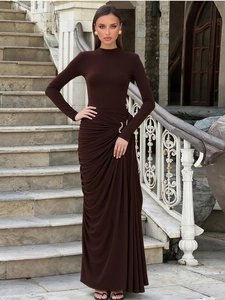 Elegant chocolate brown maxi dress with high neck, long sleeves and gold metal waist ring