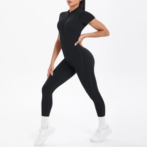 Detail view of black compression yoga jumpsuit featuring front zipper and short sleeves