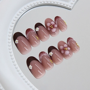 French style 3D floral press-on nails in reddish-brown with elegant daisy and lily accents