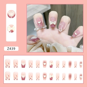 Pink gradient press-on nails set Z439 with pearl accents, hearts and bow designs