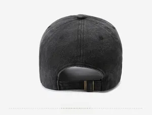 Detail view of washed cotton baseball cap featuring an adjustable brass metal buckle strap