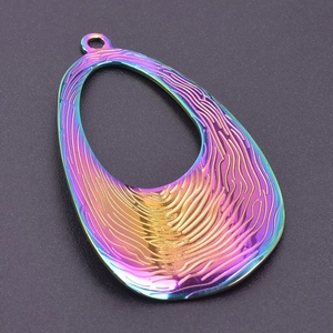 Macro shot of rainbow teardrop pendant with wave texture and 18k gold plating