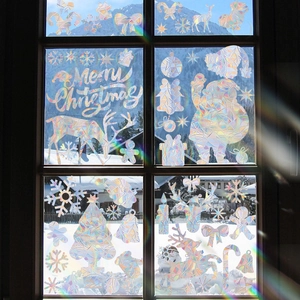 Rainbow prism Christmas window decals with Santa and reindeer on glass reflecting light