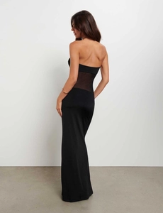 Detailed back view of sexy black tube maxi dress featuring sheer mesh waist patchwork