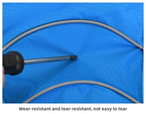Detail of durable blue ripstop nylon fabric with scratch resistant test and reflective strip