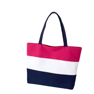 Three-color striped canvas tote bag in red white and blue on a clean white background