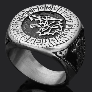 Macro view of Nordic wolf head relief and Viking runes on vintage titanium steel ring