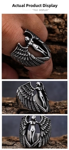 Macro detail of vintage stainless steel angel wing ring featuring detailed feather textures