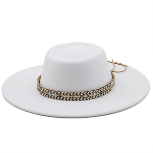 Detailed shot of white wool felt flat top hat with colorful ethnic woven decorative band